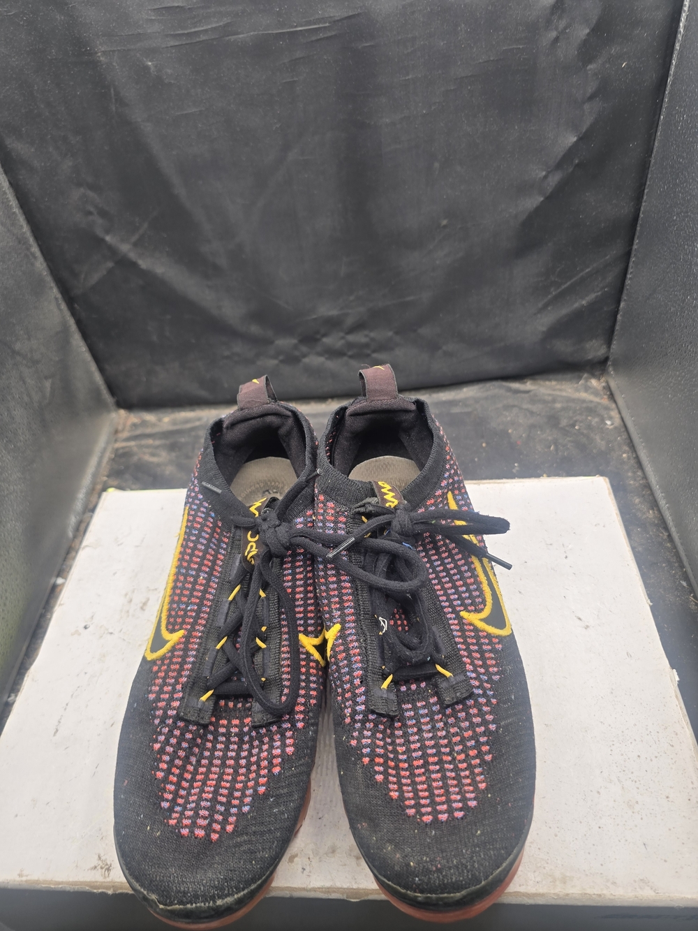 Nike Men’s Black and Red Flyknit Running Shoes with Yellow Swoosh